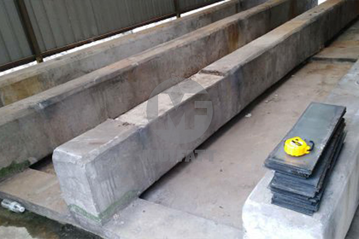 Prepared concrete plinths designed for FRP sectional panel tank installation, showcasing level alignment and structural integrity