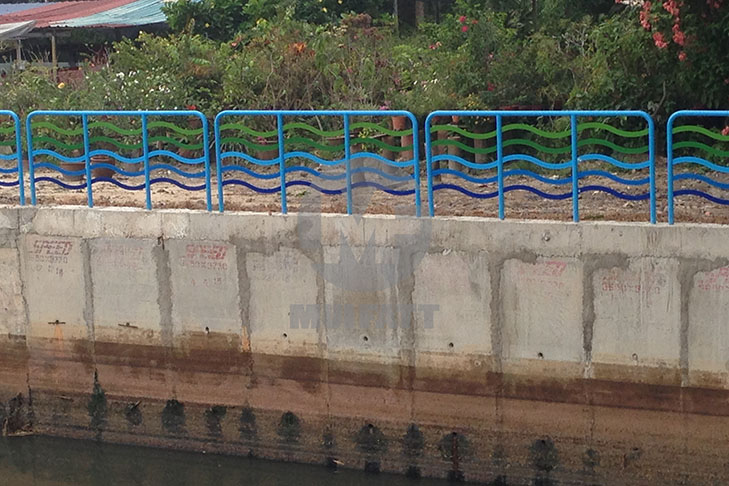 Long stretch of FRP handrails installed along landscaped canal site in Kuantan, providing safe pedestrian access and aesthetic enhancement.