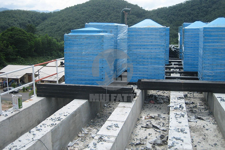Mui Fatt FRP sectional panels neatly stacked and awaiting installation on pre-constructed concrete plinths with c-channels laid in place for structural support