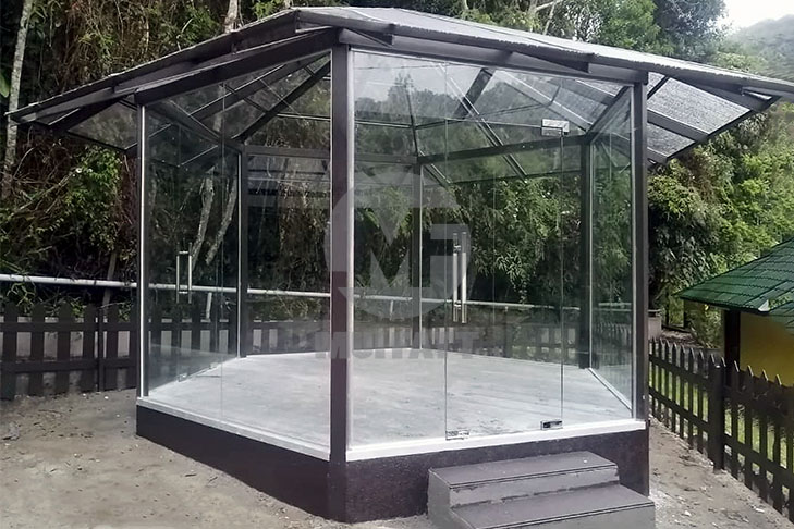Modern glass-enclosed gazebo at Parit Falls Campsite, built with FRP pultruded square hollow, L-angle, and C-channel profiles for superior strength and weather resistance