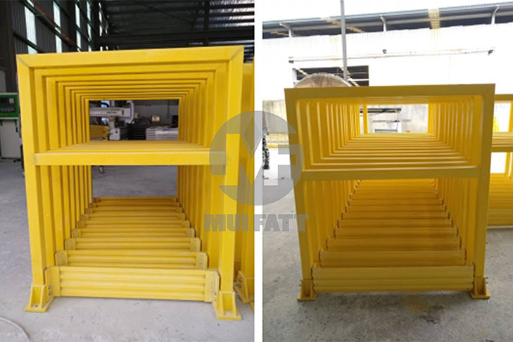 Stacked yellow FRP kickplate-integrated handrail frames supplied by Mui Fatt, ready for modular installation in industrial safety barriers.