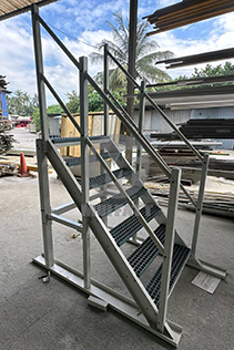 Side view of prefabricated FRP staircase built with pultruded profiles and FRP grating, ready for shipment to Kota Kinabalu STP.